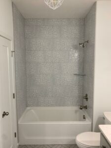 Bathroom tile with bath tub | McKean's Floor to Ceiling